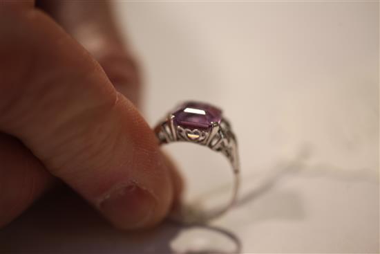 A 1920s/1930s platinum, amethyst and diamond ring, size O.